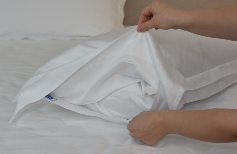 White smooth sateen pillowcases with four double ruffles